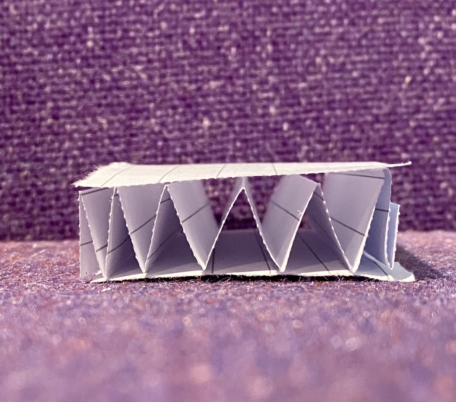 A paper model of corrugated cardboard.