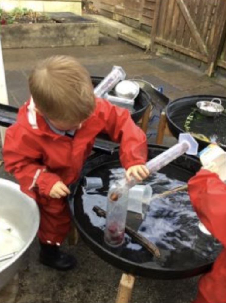 Three images of a child placing conkers and water in a measuring cylinder and then tipping the contents into another container.